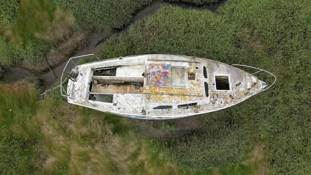 More solo lonely boats stranded at lowtide