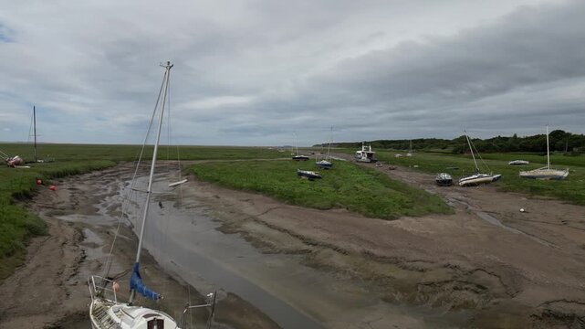 Wirral beach line with stranded boats and lonely shores