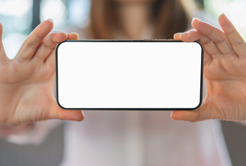 Human working on modern smartphone with blank white mobile screen for advertising, mockup, technology, advertising, search information, creative design, social media, online marketing, chat, phone