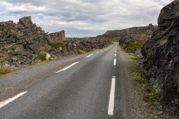 Narrow road through the rugged landscape. Road to Hamninberg. Varanger Peninsula, Norway