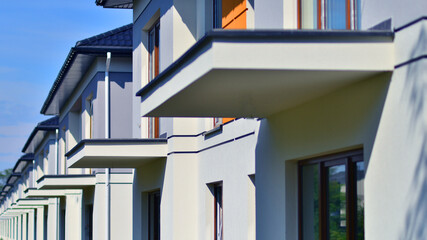 Terraced residential homes with modern facade in newly developed housing estate. The real estate...