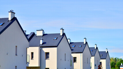 Terraced residential homes with modern facade in newly developed housing estate. The real estate...