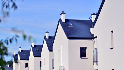 Terraced residential homes with modern facade in newly developed housing estate. The real estate...