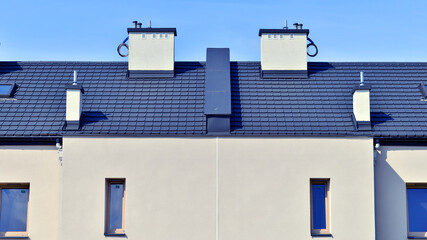 Terraced residential homes with modern facade in newly developed housing estate. The real estate...