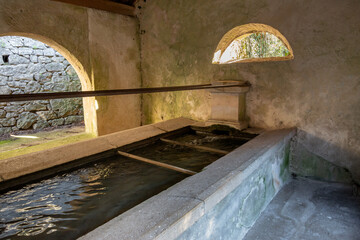 View of the washhouse in the small town of Mazaugues in the Var department, in France