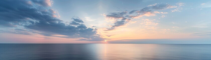 Fototapeta premium Serene Marine Dawn Horizon with Light Clouds, Tranquil Start and Copy Space - Peaceful Seascape with Deep Depth of Field