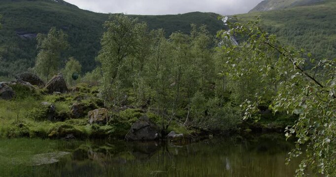 Summer in Norway. Beautiful valley Innerdalen, lake Innerdalsvatna and mountain Innerdalst&aring;rnet.