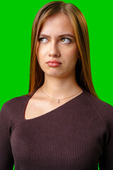Fototapeta premium Young Woman With Brown Hair Wearing Brown Sweater Looking Up