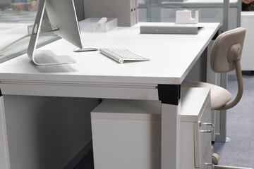 Unoccupied Workspace with Desk and Computer in Office Room