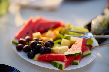 a plate of fresh fruit ready to serve