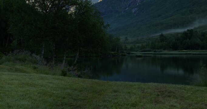 Summer in Norway. Beautiful valley Innerdalen, lake Innerdalsvatna and mountain Innerdalst&aring;rnet.