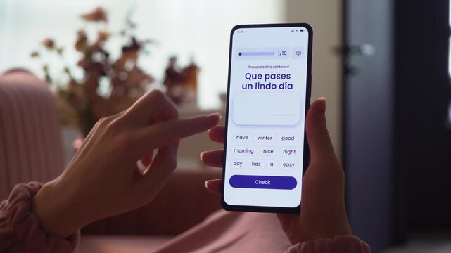 Learning a foreign language online. Studying online using e-learning application on a smartphone. Online language quiz. Fictional Interface.