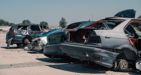 destroyed cars in a city lost in the war in Ukraine