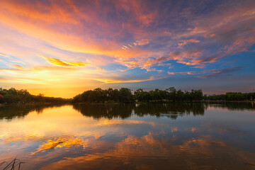 Fototapeta premium blue bright and orange yellow dramatic sunset sky in countryside texture background.