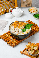 Shredded chicken porridge with ginger, cakwe and spring onions