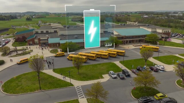 Aerial hyperlapse of students exiting American public school at dismissal. Animated charging icon for electric school buses in for USA clean energy initiatives.