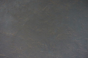 Texture of dusty and weathered dark grey painted wall