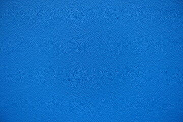 Macro of bright electric blue painted wall