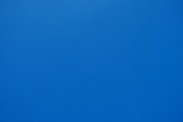 Texture of bright electric blue painted wall
