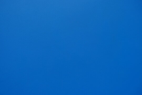 Texture of bright electric blue painted wall