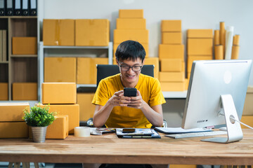 Successful male start up online seller at workplace. small business entrepreneur SME or freelance...