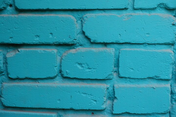 Macro of aqua blue painted brick wall