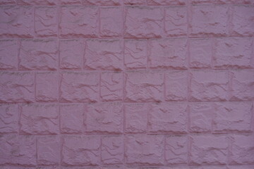 Texture of painted pink masonry veneer wall