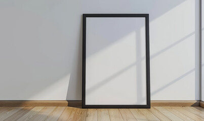 Blank frame on wooden floor against white wall with shadows