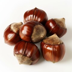 Obraz premium A few shiny brown chestnuts artistically arranged on a white background