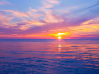 Fototapeta premium Sunset over a calm ocean with vibrant colors