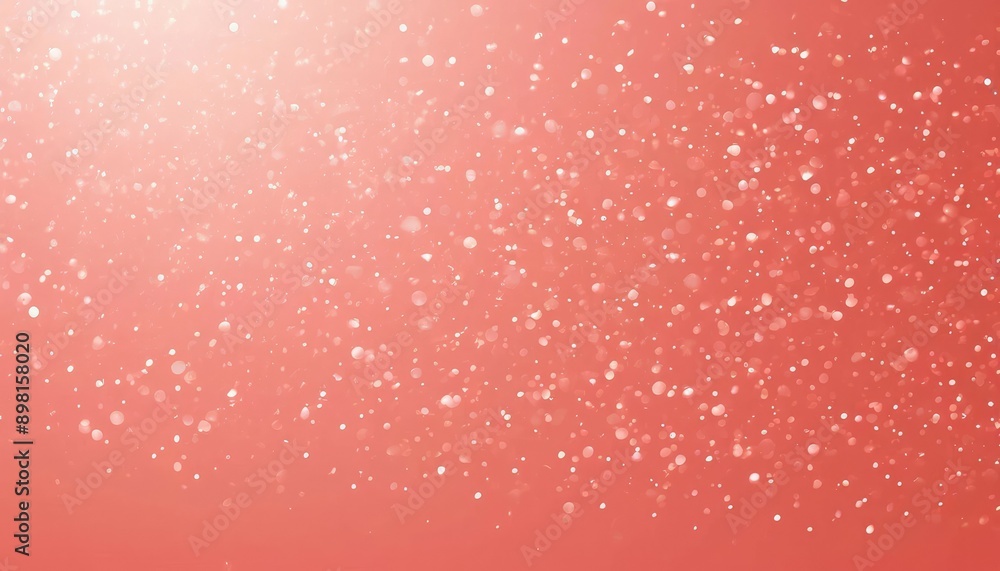 Poster the background is salmon pink with pale light grains dancing from the bottom of the screen in front 