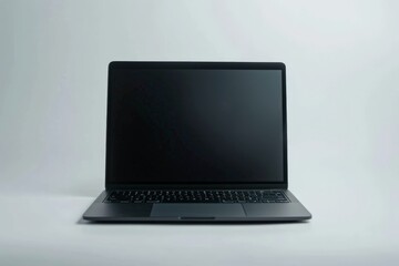 An isolated black laptop placed against a plain white background with its screen turned off, emphasizing minimalistic design and modern tech aesthetics.
