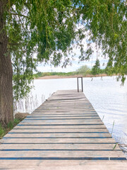 Fototapeta premium River wooden pier. View of the river from a wooden pier