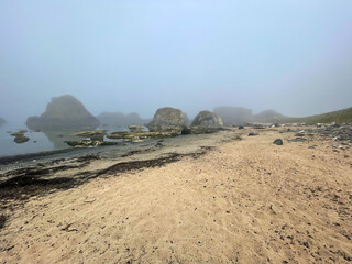 Misty Beach at Ballintoy with Rock Formations
