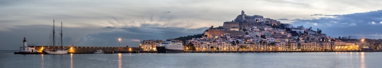 Panoramic view of the old town and port of Ibiza during sunset, a winter night.