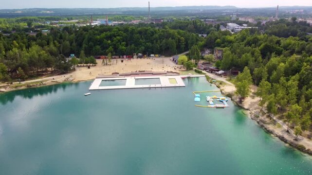 Balaton Lake Natural Swimming Pool On Reservoir During Daytime In Trzebinia, Poland. aerial pull-back, wide shot