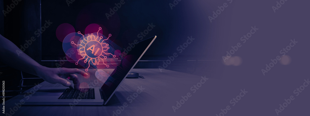 Poster hand reaches out to touch the keyboard of a laptop displaying an AI hologram on its screen. The background is dimly lit, emphasizing the focus on artificial intelligence and technology.