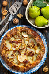 Open pie (galette) with pears, blue cheese and walnuts.