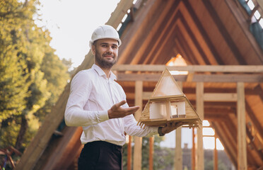Man builder. Contractor for construction company. Architect in unfinished building. Builder in...