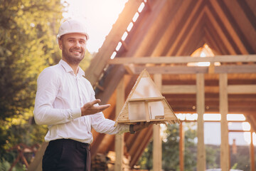Man builder. Contractor for construction company. Architect in unfinished building. Builder in...