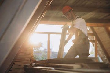 Process of construction new and modern modular house. Worker man in special protective uniform wear...