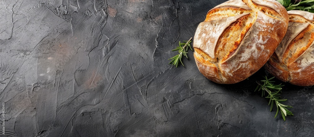 Poster Bread on a dark backdrop with ample copy space image