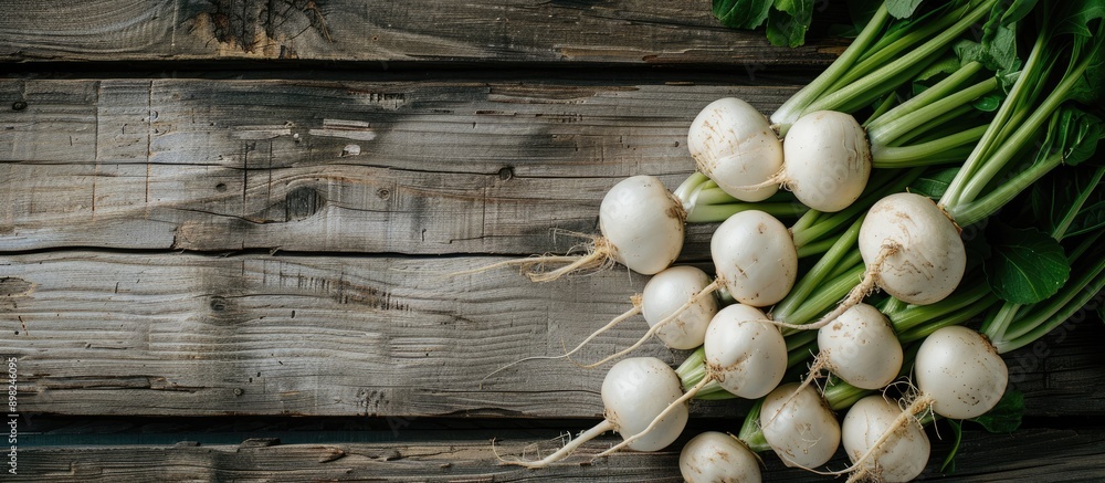 Aufkleber flat lay arrangement of white turnips on a wooden table with room for text in the copy space image