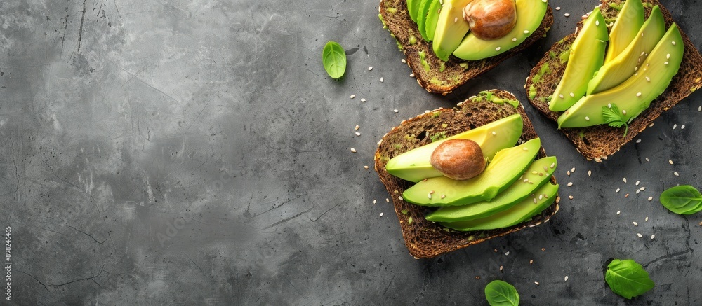 Poster Top view of avocado toast on grey background with copy space image