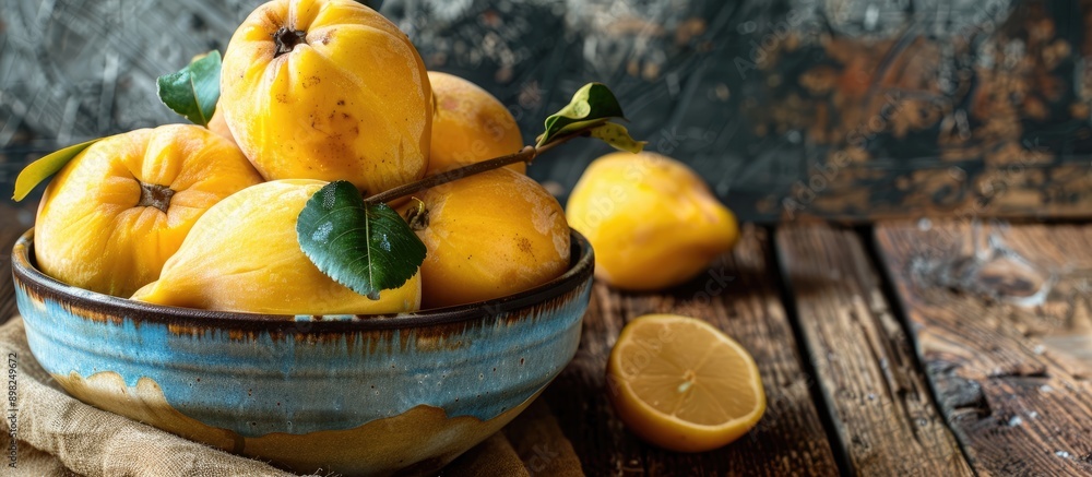 Canvas Prints close up of delicious ripe quinces in a bowl on a wooden table with copy space image available