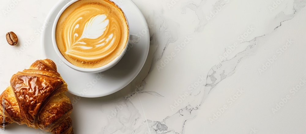 Poster A croissant and latte with artistic foam design displayed on a white surface for an appealing copy space image