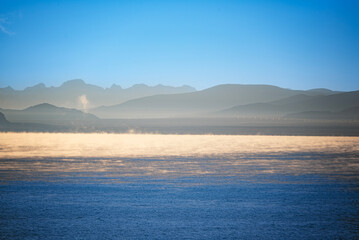 the sunrise of Peiku Co with golden fog in tibet