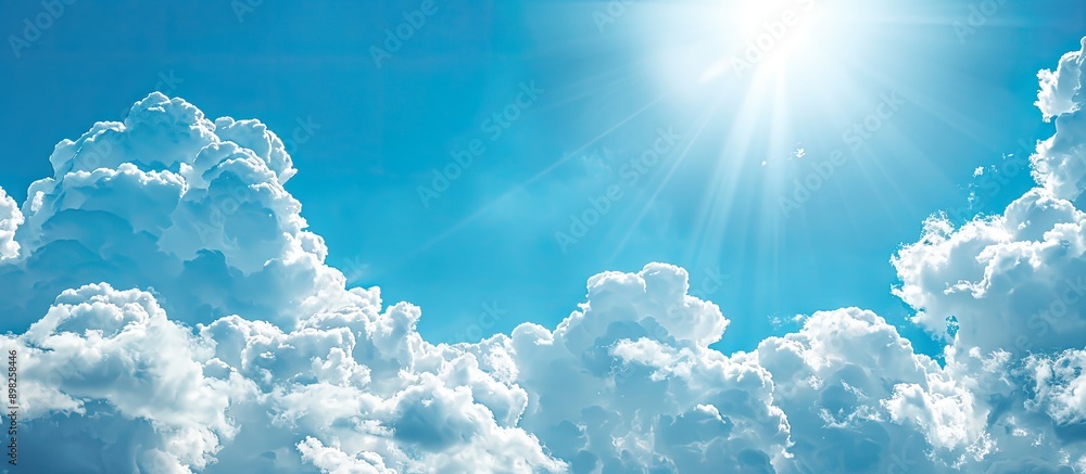 Poster background with a clear blue sky and white clouds ideal for adding text or graphics in the copy spac