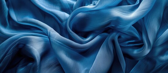 Obraz premium Abstract blue silk chiffon fabric with an artistic denim silk taffeta color layout on a background template with copy space image