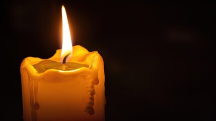 Candle Light. Fiery Flames Illuminate the Night Against Black Background
